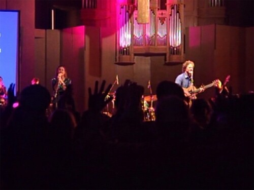 Crowds cheer the rock band at the Lourdes Sanctuary